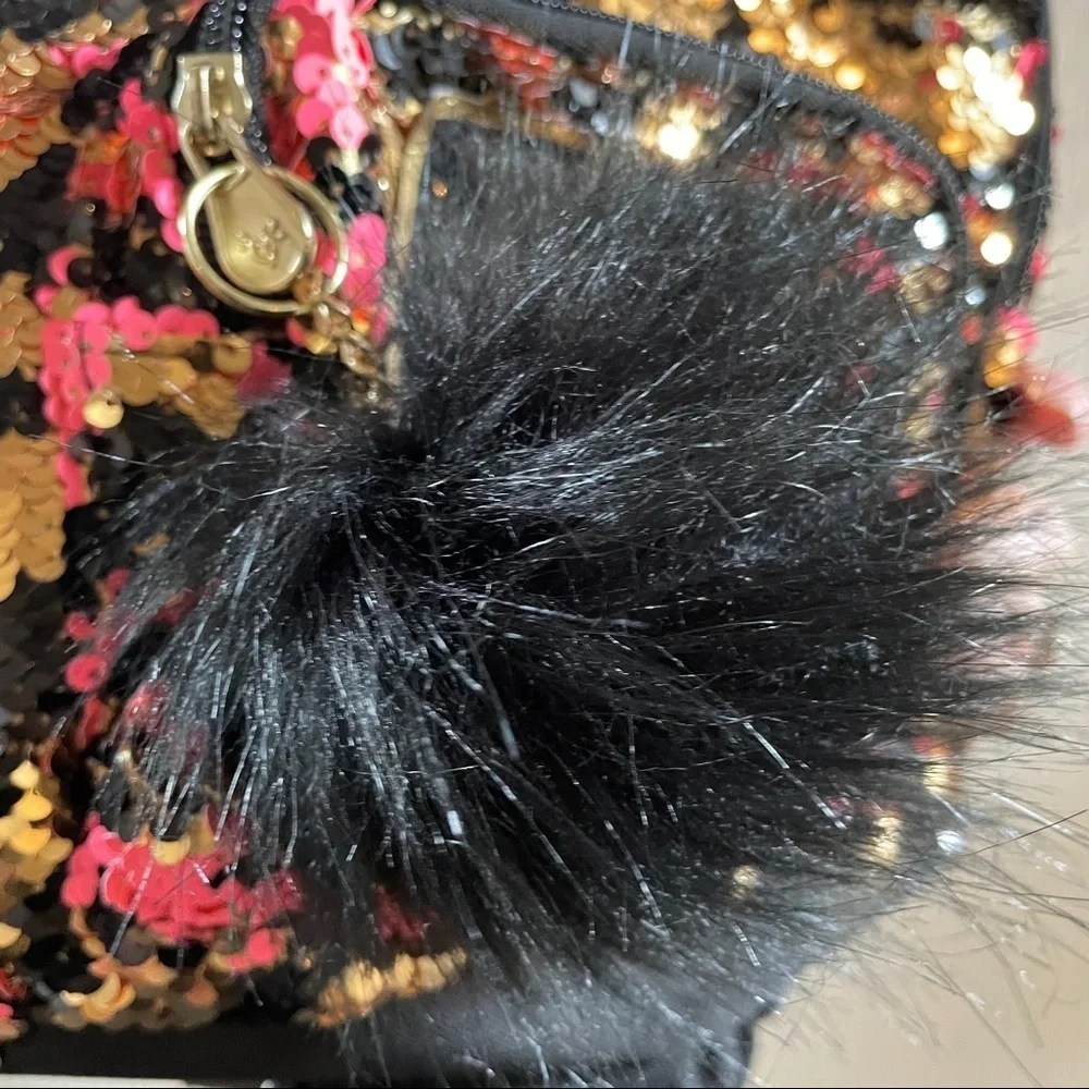 mini justice cat backpack flip sequin “F” Pom